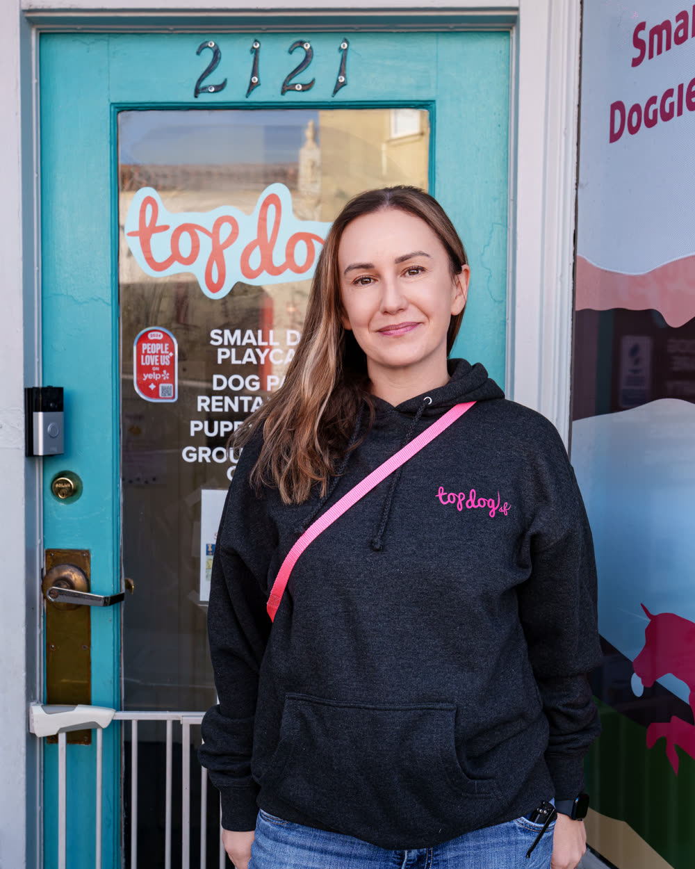 Natalie Tondelli Walsh at the door of Top Dog SF, 2121 Taraval Street, San Francisco
